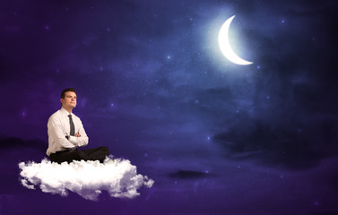 Fototapeta na wymiar Caucasian businessman sitting on a cloud, wondering