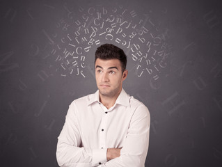 Young casual businessman with white alphabet around his head