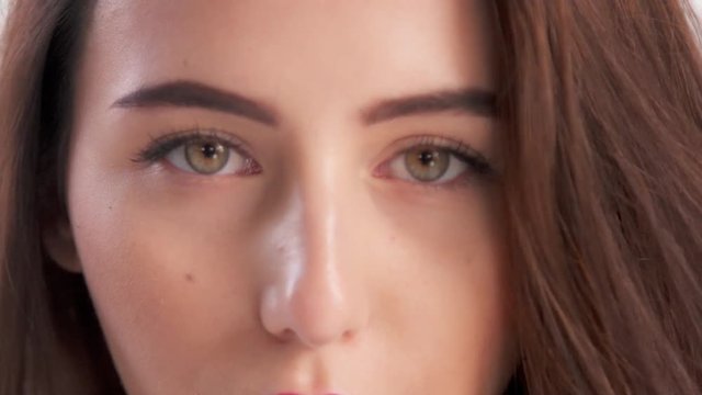 closeup of woman's eyes watching at camera
