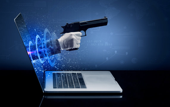 Hand with gun coming out of a laptop with sparkling effects

