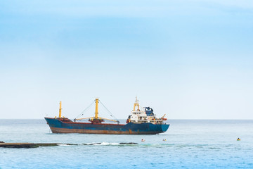 View of a cargo ship in the ocean, Bayahibe, La Altagracia, Dominican Republic. Copy space for text.