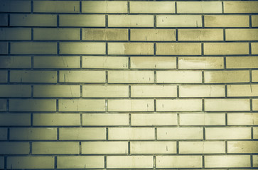 Brick wall texture of yellow stone blocks closeup