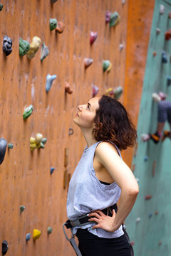  girl climbing up the wall