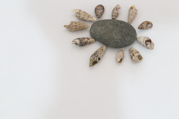 step by step making man and sun in the beach with stones on the white background for children's activity in school.Holiday handmade concept.