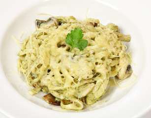 Pasta with chicken, mushrooms and pesto sauce