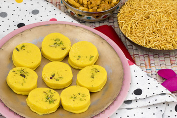 Fototapeta na wymiar Indian Sweet Food Kesar Peda Also Know as Kesar Mawa Peda, Saffron Sweet, Saffron Peda is a saffron flavoured soft, dense sweet that is specially made during festivals