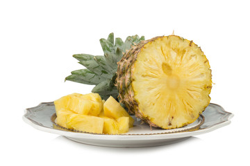 pineapple on dish half isolated on white background
