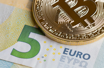 Bitcoin Cryptocurrency is Digital payment money, Gold coins with B letter symbol electronic circuit on EURO EYP5 bill.Cryptocurrency can uses designed,Business Finance and Investment Risk Ideas