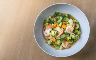 Healthy meal, stir fried vegetables with shrimps. Top view food.