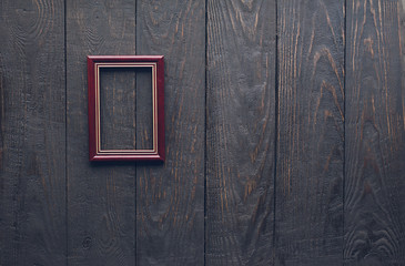 photo frame on old wooden wall