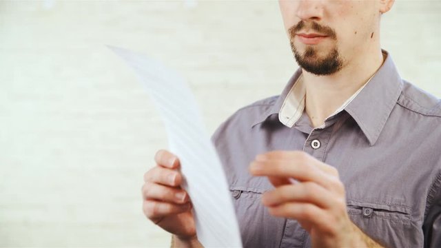 Read and tear apart contract agreement in slow motion 4K