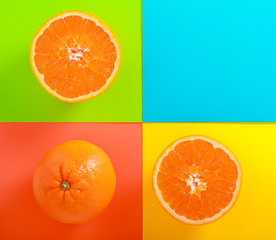 Oranges halved over colorful background
