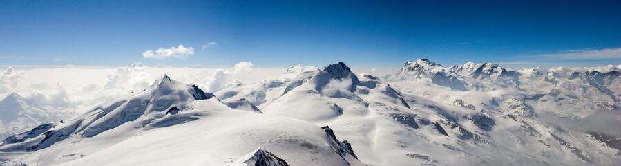 panorama mountain landscape in the Swiss Alps near Zermatt on a beautiful day in late winter under...