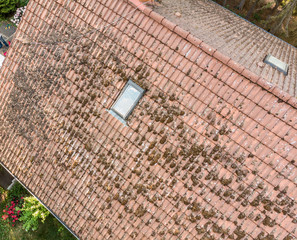 Overflight of the roof of a single-family house to check the condition of the roof tiles, aerial...