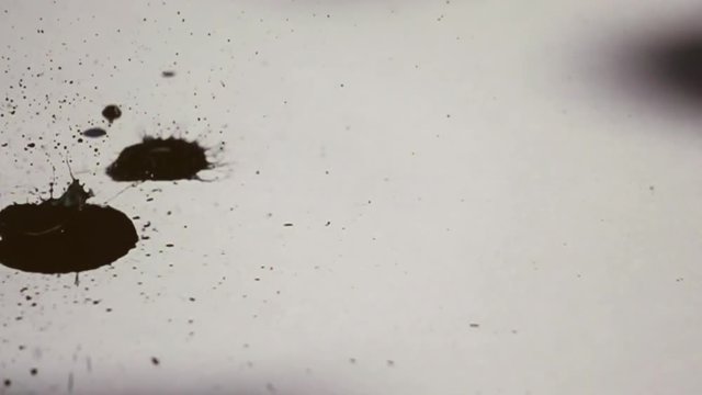 Ink spot on white background.A drop in the slowdown of 960 frames per second