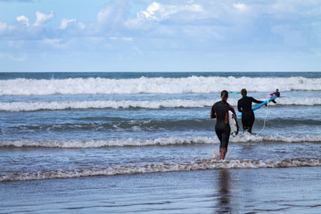 Fototapeta na wymiar Surfer. Atlantic Ocean. Photo travel. Leisure. Surfing. Sport