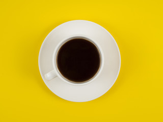 Cup coffee isolated on yellow