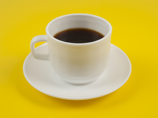 Cup coffee isolated on yellow