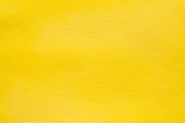yellow watercolor painted on paper background texture