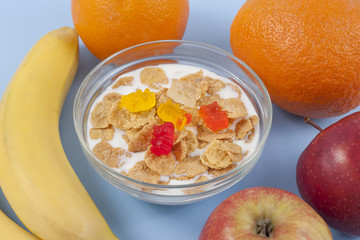 Healthy eating breakfast bowl of low calories muesli with fruits and milk