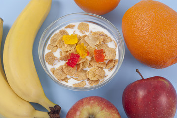 Healthy eating breakfast bowl of low calories muesli with fruits and milk