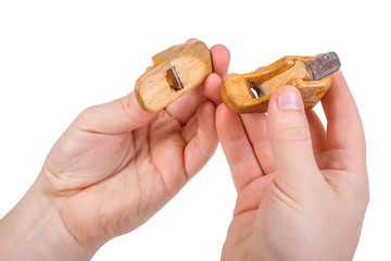 Craftman holding miniature hand planes
