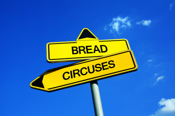Bread and circuses - Traffic sign with two options - food, meal and aliemntation vs entertainment and fun. Idiom meaning - satisfaction and appeasement of people, folk and society. 
