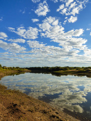 A view of the pampa biome, clouds reflecting on the Uruguay river - Uruguaiana, Brazil