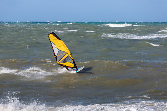 Sea Waves and Wind Surfing in the Summer in Windy Day
