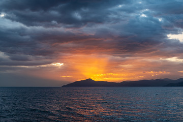 Naklejka na ściany i meble Sunset during a navigation to Portofino