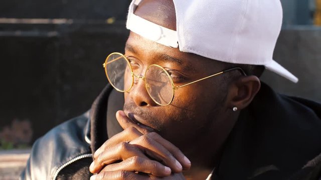 Young afro man thinking