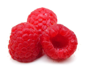 ripe red raspberry on white background