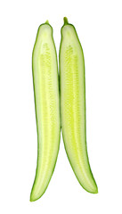 Two cut halves of standing green cucumber isolated on white