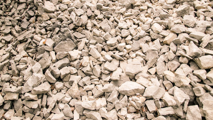 Background formed by a quarry of white pebbles.