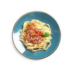 Plate with delicious pasta bolognese on white background, top view