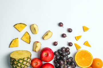 Rainbow composition with fresh vegetables and fruits on white background, flat lay