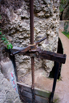 irrigation sluice system with rusty shutoff wheel in ronda, andalusia, spain