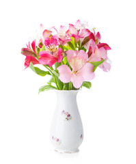 Bouquet of Alstroemeria flowers in  old  porcelain vase isolated on white background.