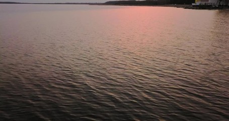 beautiful flight over the lake and the beach at sunset. landscape