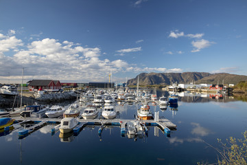 Fototapeta na wymiar Blue sky and calm weather in Salhus marina in Northern Norway 