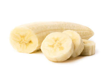 Ripe banana peeled cut into pieces on a white, closeup.
