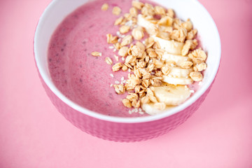 pink smoothie bowl cereal and banana