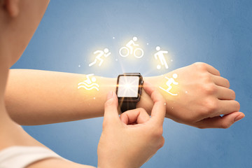 Female hand with smartwatch and sport concept.