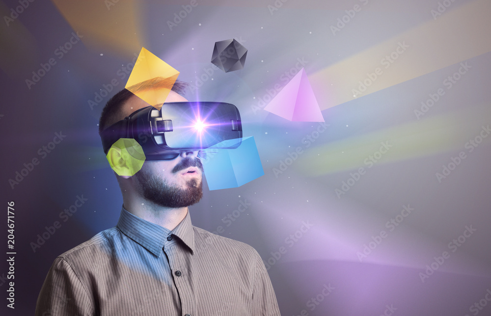 Poster amazed businessman with virtual reality colorful geometric shapes in front of him