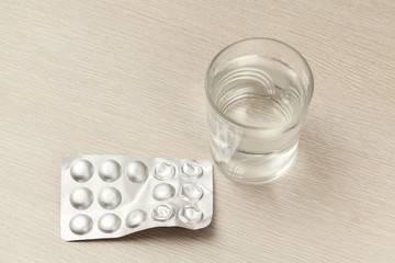 drugs on wooden table