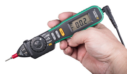 Pen type digital multimeter with non-contact voltage indication. Close-up of an engineer's hand holding the electronic measuring instrument. Display, buttons and probe. Isolated on white background.