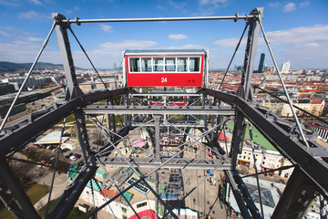 Fototapeta premium View of Prater Ferris Wheel, Vienna, Austria among spring green trees