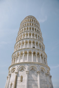 Looking up at the top section of the leaning tower of Pisa, Italy
