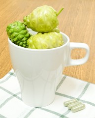 Green Noni or Morinda Citrifolia Fruits with Herbal Tablets