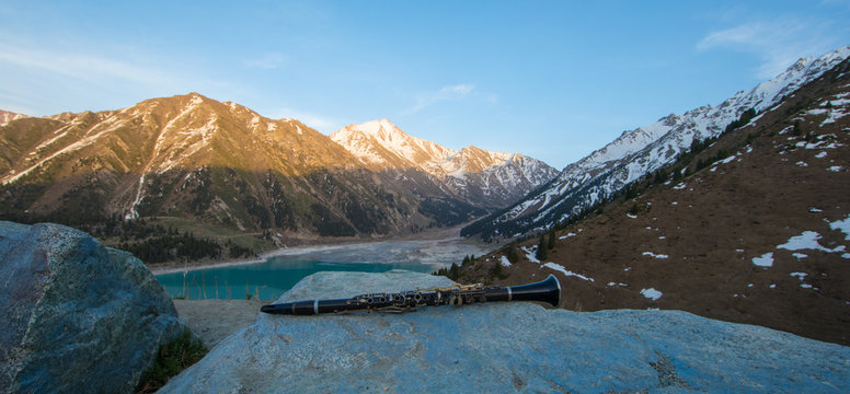 clarinet, mountain landscape and lake